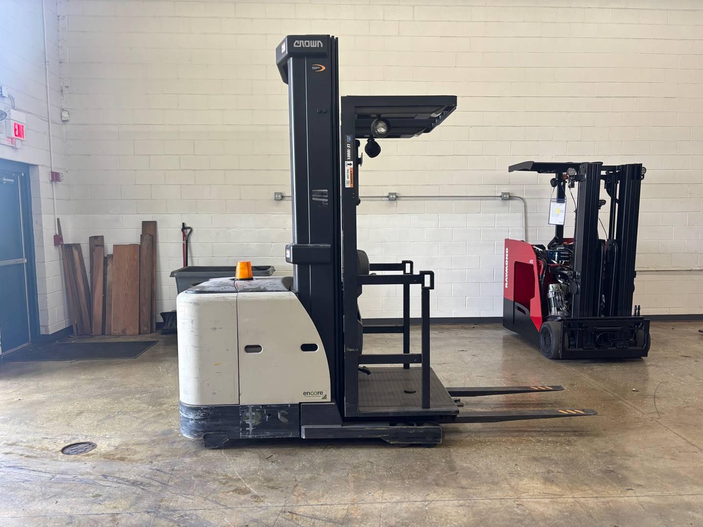 Crown stand-up reach truck forklift inside warehouse