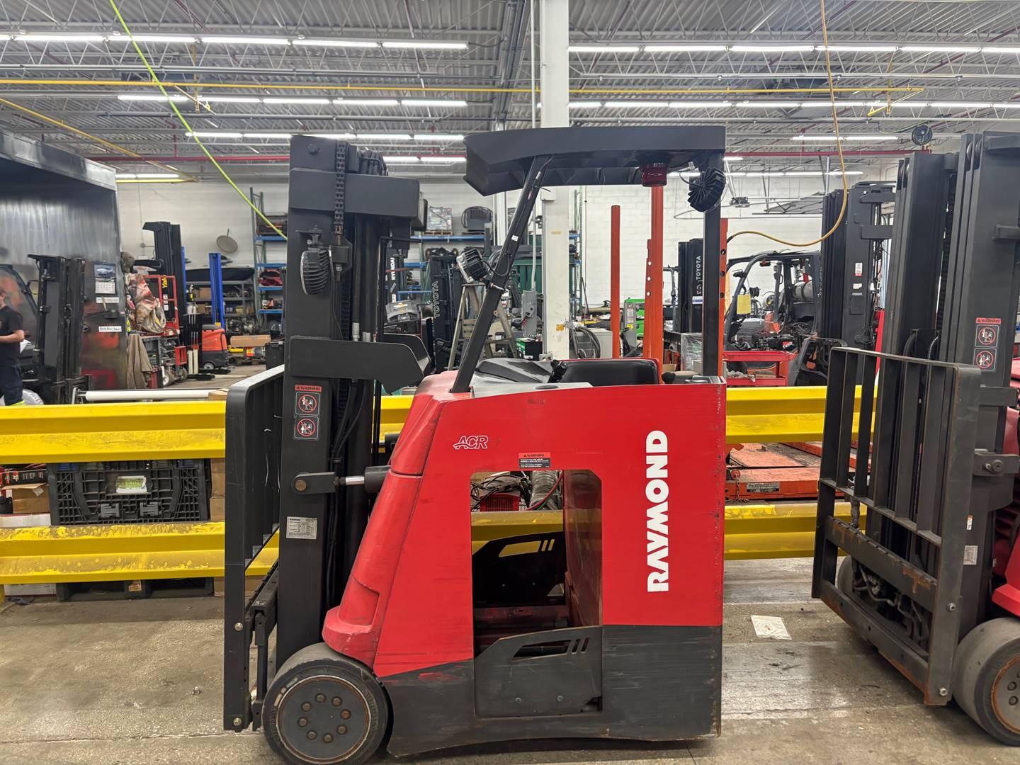 Raymond reach truck forklift inside warehouse