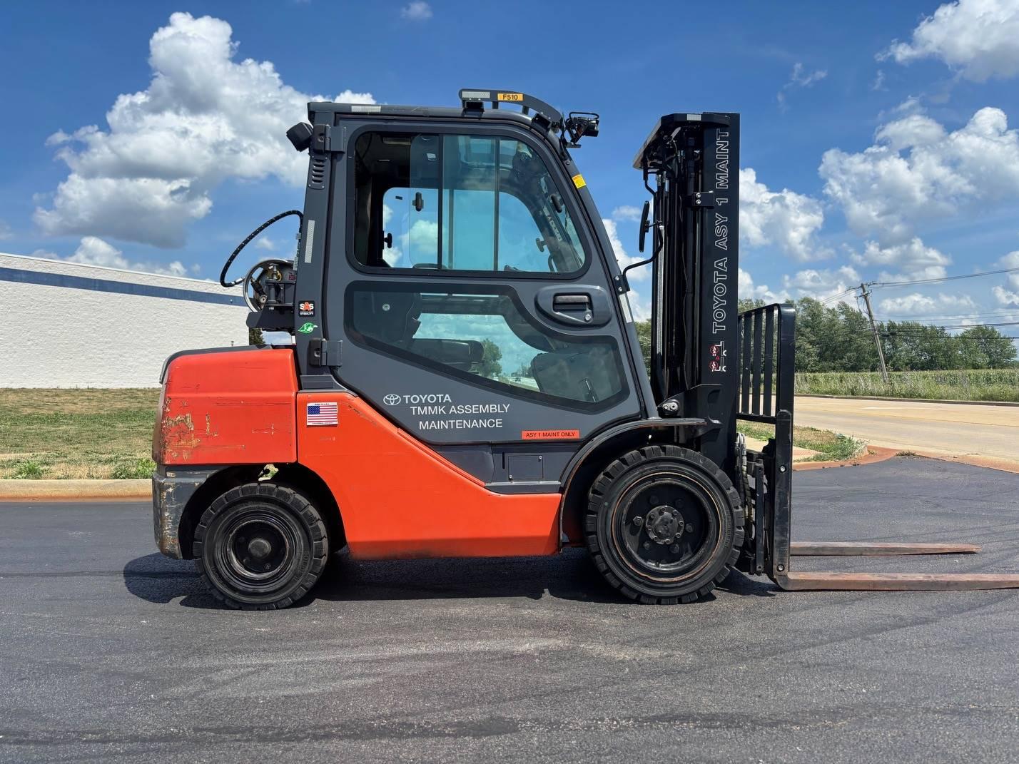 Toyota forklift side view parked outdoors