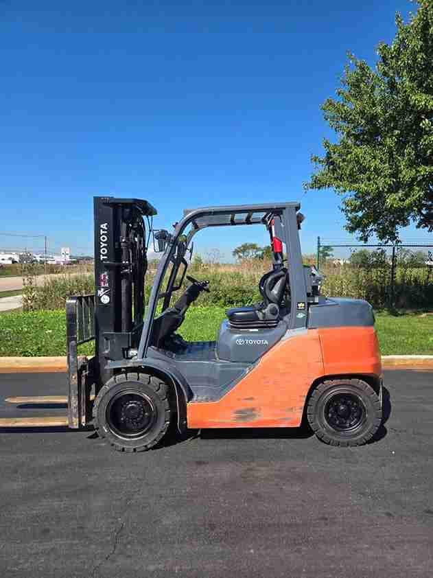 toyota forklift side view parked outdoor industrial material handling equipment