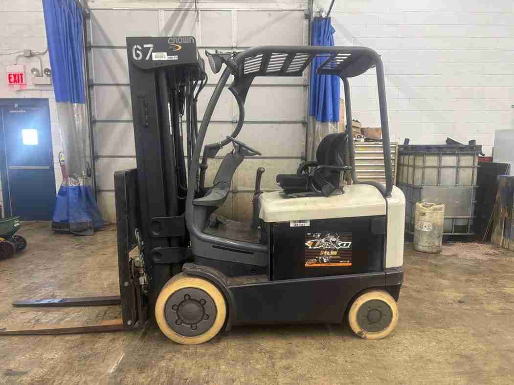 Black forklift with forks extended