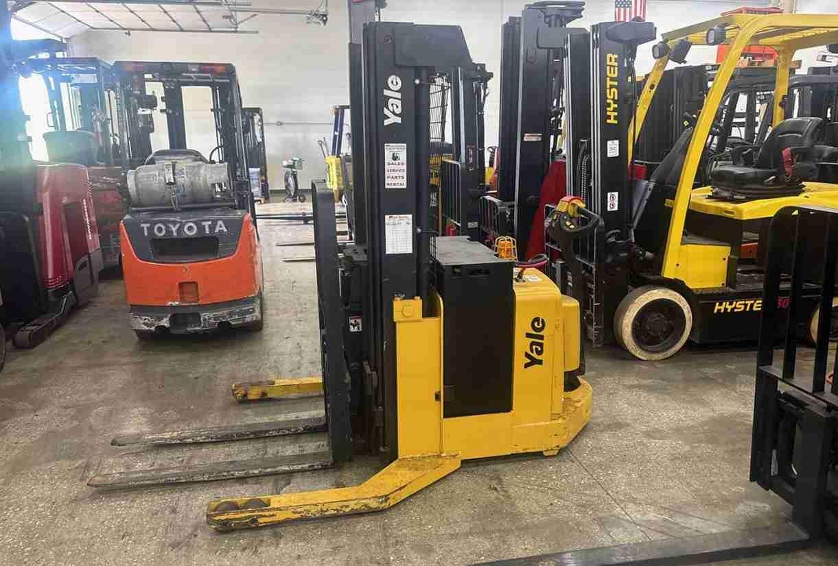 Yellow reach truck in warehouse